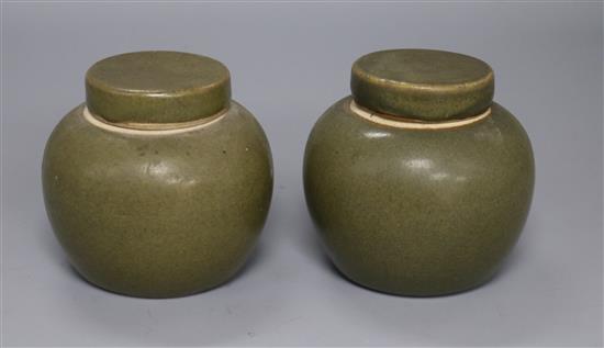 A pair of Chinese teadust glazed small jars and covers, early 20th century, 8cm high